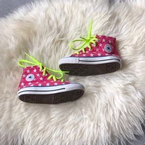 Hot pink ROCKSTAR Converse high tops